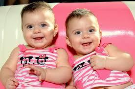 Twin babies smiling