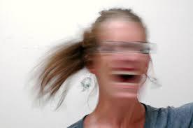 A blurry picture of a woman screaming