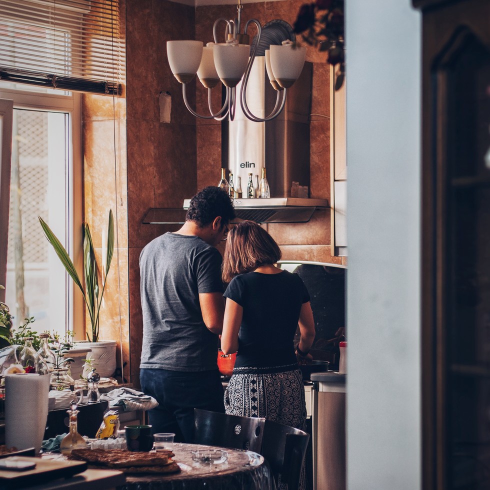 A couple preparing food in their kitchen